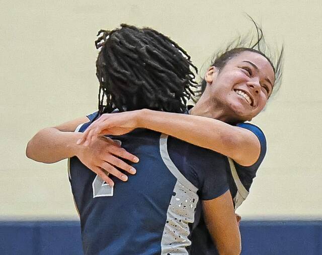 Rochesters Kamryn Newman (back) and Marque Taylor (2) celebrate during a win over Riverview in the WPIAL playoffs last year. (Andrew Palla | For TribLive).