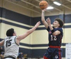 Shalers Jordan Epps scores over Franklin Regionals Anthony Mitchell during WPIAL Class 5A first-round action Tuesday, Feb. 17, 2026 at Franklin Regional High School. (Chaz Palla | TribLive)