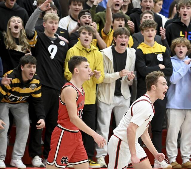 Fox Chapels Grant Fenton celebrates in front of the student section after hitting a 3-pointer at the third-quarter buzzer against New Castle on Friday, Jan. 9, 2026, at Fox Chapel. (Christopher Horner | TribLive)