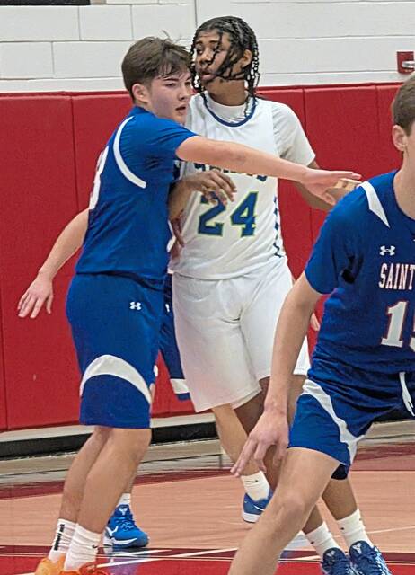 St. Joseph sophomore Kyle Lecker works against Nazareth Prep freshman Ahsan Harrison during the fourth quarter of a WPIAL Class A quarterfinal Wednesday. (Michael Love | TribLive)