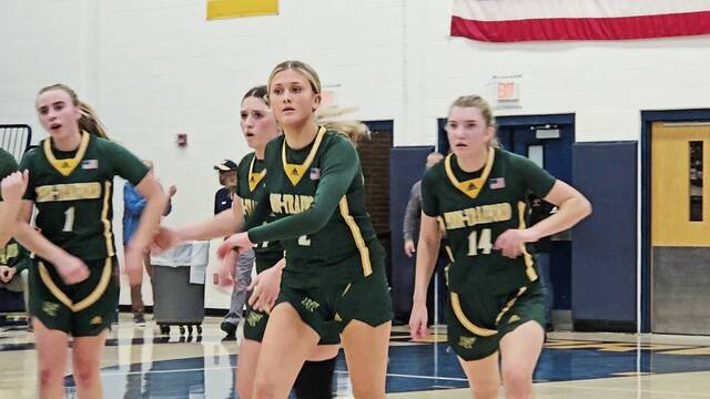 Penn-Trafford players (from left) Izzie Fontana, Torrie DeStefano, Raya Johnson and Hanna Weishaar leave the court after Weishaar's buzzer-beaiting layup to end the first half Wednesday night at Norwin. (Bill Beckner Jr. | TribLive)