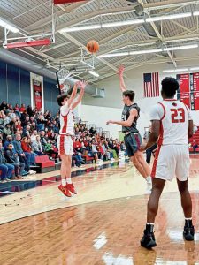 Sewickley Academys Eric Craciun hits a 3-pointer against Greensburg Central Catholic in the Class 2A first round Feb. 16. (Antonio Rossetti | For TribLive)