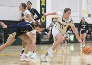 Penn-Traffords Alyssa Bridges gets away from Franklin Regionals Katherine Yaniga with a loose ball during the WPIAL first round. (Chaz Palla | TribLive)
