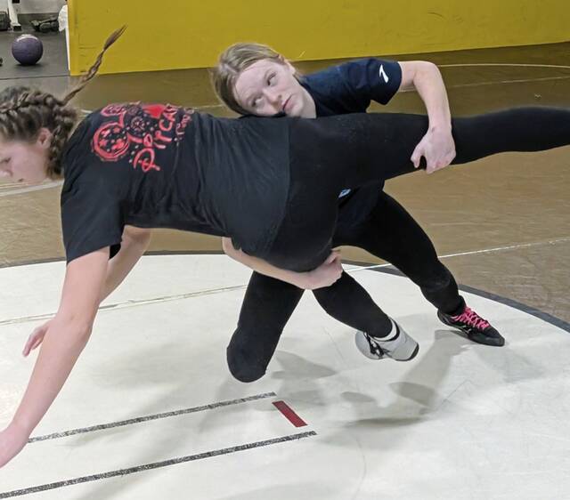 Gateway junior Savannah Boden works to take down sister Sierra, a freshman, during a practice in Feburary in the wrestling room at Gateway’s Furrie Sports Complex. Six Gators wrestlers will compete at the WPIAL girls championships Feb. 20, 2026, at Mt. Lebanon High School. (Michael Love | TribLive)