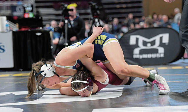 Kiski Areas Ava Golding wrestles Abingtons Michelle Yakupova at 136 pounds during the PIAA Class 2A wrestling tournament March 6, 2025, at Giant Center in Hershey. (Louis B. Ruediger | TribLive)
