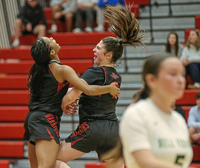 Elizabeth Forward's Kaelynn Settles and Mia Sostaric celebrate during Thursday's victory over Belle Vernon. (Mike Darnay | Mon Valley Independent)