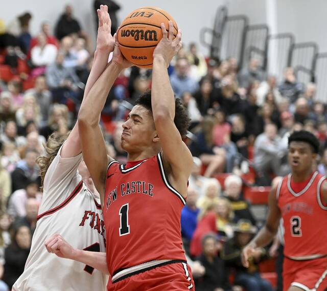 New Castles Marino Graham drives against Fox Chapels Jackson Helgert on Jan. 9. (Christopher Horner | TribLive)
