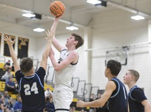 Knochs Derek Lang scores over Central Valleys Parker Lewchenko during the WPIAL Class 4A quarterfinal Wednesday, Feb. 17, 2026 at North Allegheny High School. (Chaz Palla | TribLive)