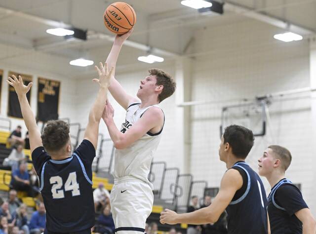 Knochs Derek Lang scores over Central Valleys Parker Lewchenko during the WPIAL Class 4A quarterfinal Wednesday, Feb. 17, 2026 at North Allegheny High School. (Chaz Palla | TribLive)