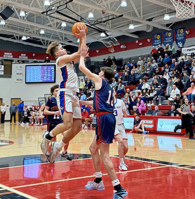Chartiers Valley's Julian Semplice drives to the basket as Shaler's Trey Kostorick defends in the WPIAL Class 5A quarterfinals Friday, Feb. 20, 2026. (Antonio Rossetti | For TribLive)