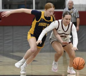 Shady Side Academys Morgan Kane battles Greensburg Centrals Sophia Detwiler for a loose ball on Jan. 8. (Christopher Horner | TribLive)