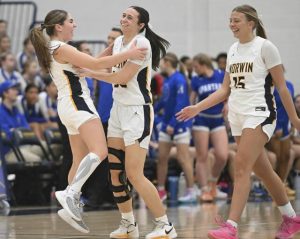 Norwins Giuliana Glannikas (left) celebrates with Ava Christopher after hitting a 3-pointer against Hempfield during WPIAL Class 6A playoff action Feb. 20, 2026 at Norwin High School. (Chaz Palla | TribLive)