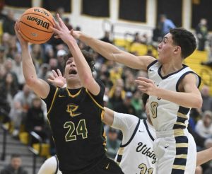 Deer Lakes Evan Moore scores past Hopewells Jack Biega during the WPIAL Class 4A quarterfinals Feb. 17, 2026 at North Allegheny High School. (Chaz Palla | TribLive)
