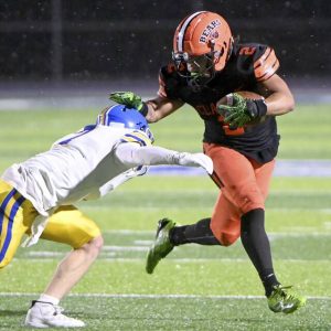 Clairtons Donte Wright stiff-arms Greenvilles Cael Thurber during their PIAA Class A semifinal on Friday, Nov. 28, 2025, at Helling Stadium in Ellwood City. (Christopher Horner | TribLive)