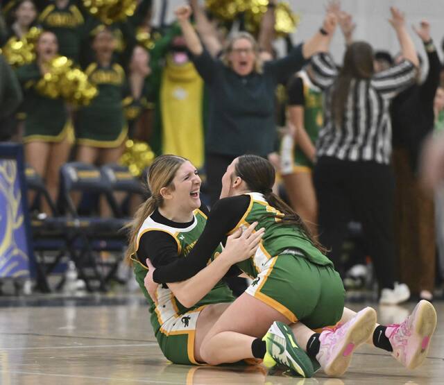 Geibel Catholics Emma Larkin celebrates with Mallory Clemmer (left) after defeating Aquinas Academy during the WPIAL Class A semifinals Monday at Norwin. (Chaz Palla | TribLive)