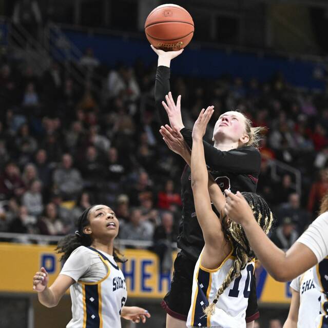 Greensburg Central Catholics Erica Gribble scores over Shady Side Academys Cameron Capel during the 2025 WPIAL Class 3A championship game at Petersen Events Center. (Chaz Palla | TribLive)