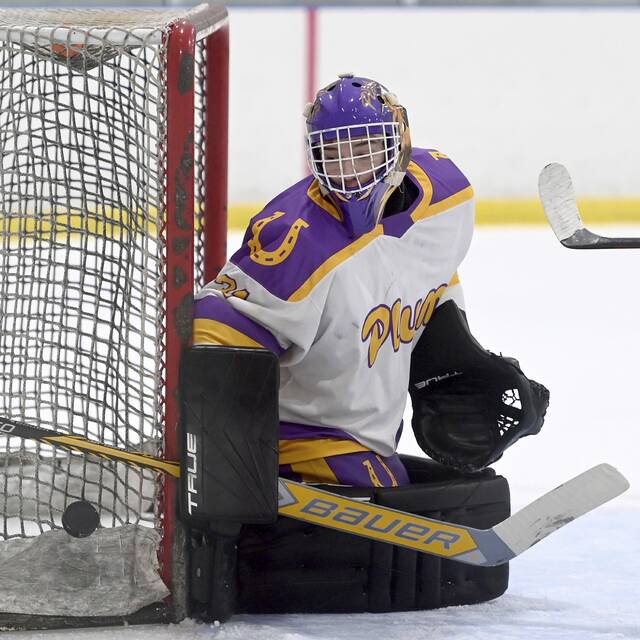 Plum goalie Brody Gribbin makes a save against Greensburg Salem on Nov. 24, 2025, at Pittsburgh Ice Arena. (Christopher Horner | TribLive)