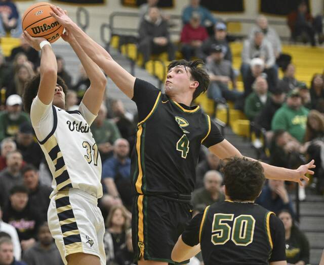 Deer Lakes Luca Mangieri blocks the shot of Hopewells Justin Shegog during the WPIAL Class 4A quarterfinals Feb. 17, 2026 at North Allegheny High School. (Chaz Palla | TribLive)