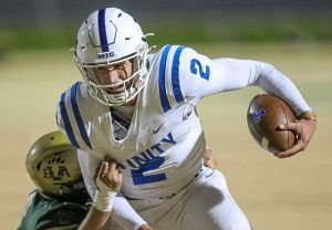 Trinitys Jonah Williamson sheds a tackle attempt by Belle Vernons Jace Gedekoh en route to a touchdown Friday, Oct. 24, 2025. (Mike Darnay | Mon Valley Independent)