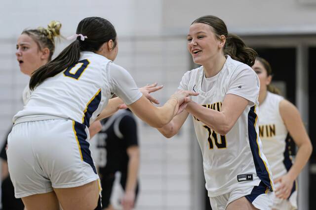 Norwin's Lenyn Brozeski (left) and Ava Christopher react heading into a timeout after a made basket on Tuesday, Feb. 24, 2026, at Keystone Oaks. (Andrew Palla | For TribLive)