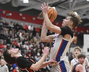 Chartiers Valleys Julian Semplice is called for charging on Moons Caden Kopay during the WPIAL Class 5A semifinals Tuesday. (Chaz Palla | TribLive)