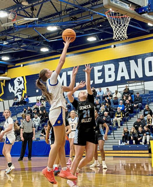 Canon-McMillan's Brooke Stanton shoots as Seneca Valley's Ella Omasits defends in the WPIAL Class 6A semifinals Tuesday. Feb. 24, 2026. (Antonio Rossetti | For TribLive)