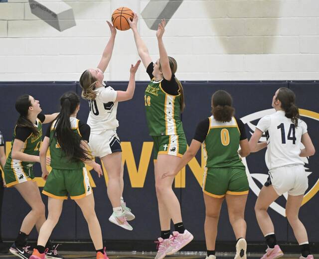 Geibel Catholics Mallory Clemmer blocks the shot of Aquinas Academys Fracesca Hite during the WPIAL A semifinals Monday. (Chaz Palla | TribLive)