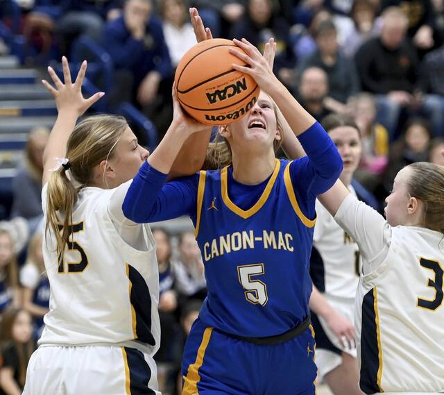 Canon-McMillan’s Madison Clair drives through the Norwin defense on Monday, Feb. 2, 2026, at Norwin. (Christopher Horner | TribLive)
