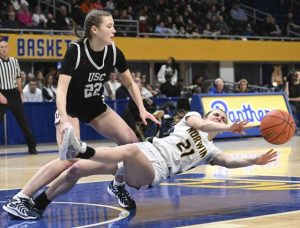 Upper St. Clairs Kat Polstyanko fouls Norwins Liz Yarosik during the 2025 WPIAL Class 6A championship game	at Petersen Events Center. (Chaz Palla | TribLive)