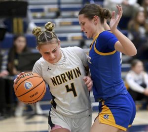 Norwins Nia OBarto works against Canon-McMillans Brooke Stanton on Feb. 2 at Norwin. (Christopher Horner | TribLive)