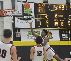 New Castle senior Damian Harrison puts up a shot during a WPIAL Class 6A semifinal against Central Catholic on Monday. (Paul Schofield | TribLive)