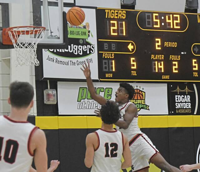 New Castle senior Damian Harrison puts up a shot during a WPIAL Class 6A semifinal against Central Catholic on Monday. (Paul Schofield | TribLive)
