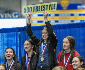 North Alleghenys Claire Bacu stands atop the podium after winning the 500 freestyle during the 2025 WPIAL Class 3A swimming championships Feb. 28, 2025, at Pitts Trees Pool. (Andrew Palla | For TribLive)