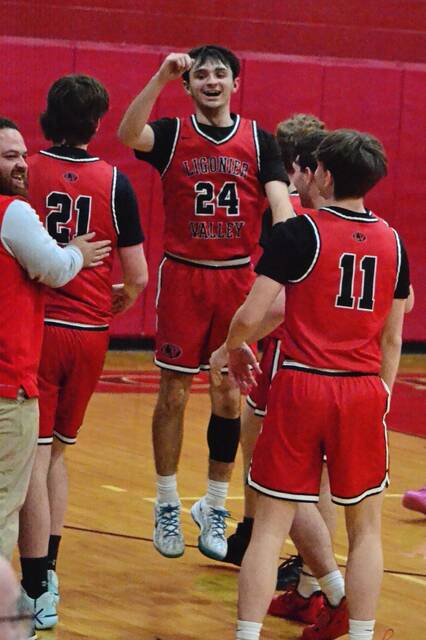 Ligonier Valley's Noah Knupp (24) celebrates with Levi Moser (21) and Jacob Petalino (11) during a WPIAL Class 3A seventh-place game against Southmoreland on Wednesday, Feb. 25, 2026. (Paul S. Brittain | Daily Courier)