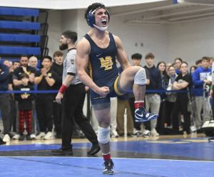 Mt. Lebanons Cole Gibbons celebrates after beating Norwins Jack White in the 160-pound bout during the WPIAL Class 3A wrestling championship Feb. 21, 2026 at Canon-McMillan High School. (Chaz Palla | TribLive)