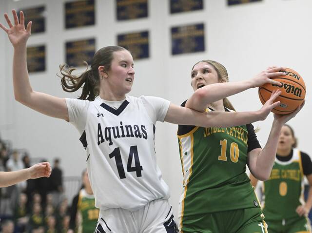 Geibel Catholics Mallory Clemmer grabs a rebound from Aquinas Academys Katie Tarquinio during the WPIAL Class A semifinals Feb. 23, 2026 at Norwin High School. (Chaz Palla | TribLive)