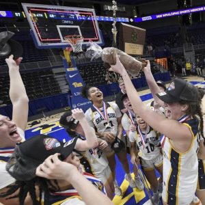 Shady Side Academys Cassie Sauer hoists the WPIAL championship trophy with her teammates after defeating Greensburg Central Catholic in the Class 3A final Thursday at Petersen Events Center. (Christopher Horner | TribLive)