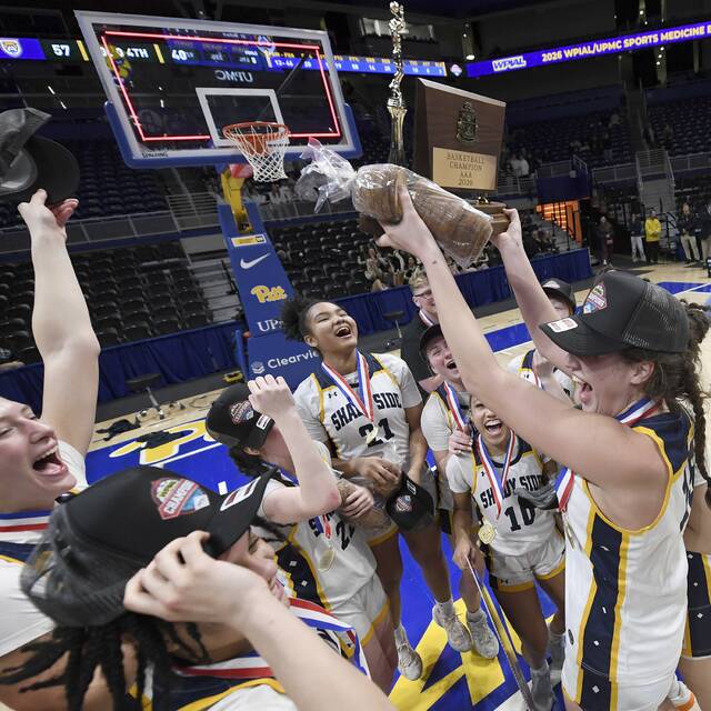 Shady Side Academys Cassie Sauer hoists the WPIAL championship trophy with her teammates after defeating Greensburg Central Catholic in the Class 3A final Thursday at Petersen Events Center. (Christopher Horner | TribLive)