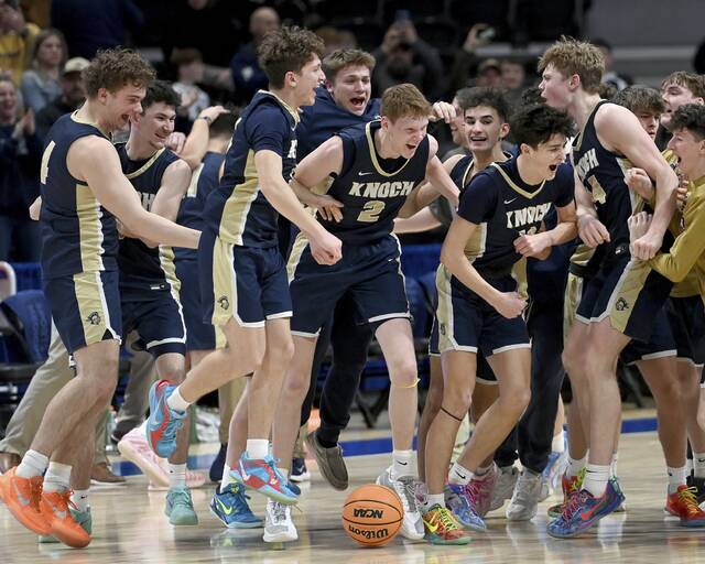 The Knoch basketball team celebrates after defeating Quaker Valley in the WPIAL Class 4A championship game on Thursday, Feb. 26, 2026, at Petersen Events Center. (Christopher Horner | TribLive)