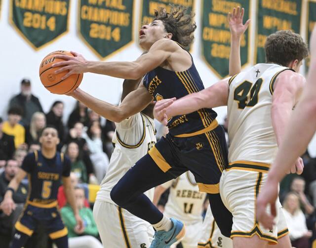 South Alleghenys Drew Cook is fouled by Seton LaSalles Will Martin on Jan. 6, 2026 at Seton LaSalle High School. (Chaz Palla | TribLive)