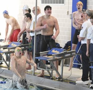 Northgates 400 relay of Sam Cavanaugh, Nate Parker, Jakob Vranick and Greyson McKelvey (in the water) celebrate after winning during the WPIAL Class 2A swimming championships Friday, Feb. 27, 2026 at Trees Pool. (Chaz Palla | TribLive)