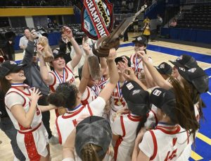 Neshannock celebrates with the trophy after beating Winchester Thurston during the WPIAL Class 2A girls basketball championships Saturday, Feb. 28, 2026 at Petersen Events Center. (Chaz Palla | TribLive)