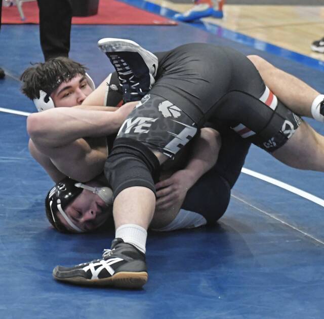Kiski Area senior Cooper Roscosky fends off a takedown attempt by DuBois sophomore Kendahl Hoare in a 215-pound semifinal on Feb. 28, 2026. (Paul Schofield | TribLive)