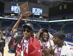 Aliquippas Qalil Goode celebrates with the trophy after beating South Allegheny during the WPIAL Class 2A boys basketball championships Saturday, Feb. 28, 2026 at Petersen Events Center. (Chaz Palla | TribLive)