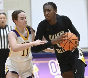 Quaker Valleys Mimi Thiero works against OLSHs Sara Daeschner on Jan. 22. (Christopher Horner | TribLive)