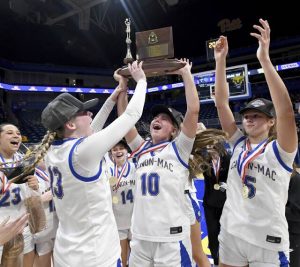 The Canon-McMillan basketball team celebrates with the WPIAL championship trophy after defeating Norwin in the Class 6A final on Saturday, Feb. 28, 2026, at Petersen Events Center. (Christopher Horner | TribLive)