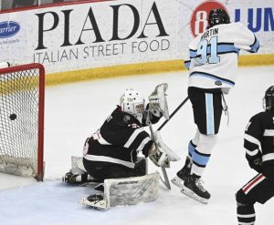 Seneca Valleys Owen Martin watches John Sroka IIIs shot as it beats Upper St. Clairs Owen Laurent during the 2025 PIHL Class 3A semifinals. (Chaz Palla | TribLive)