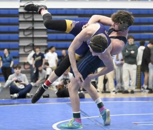 Franklin Regionals Michael Ruane wrestles Plums Owen Campbell in the 152 pound bout during the WPIAL Class 3A wrestling championship Feb. 21 at Canon-McMillan High School. (Chaz Palla | TribLive)