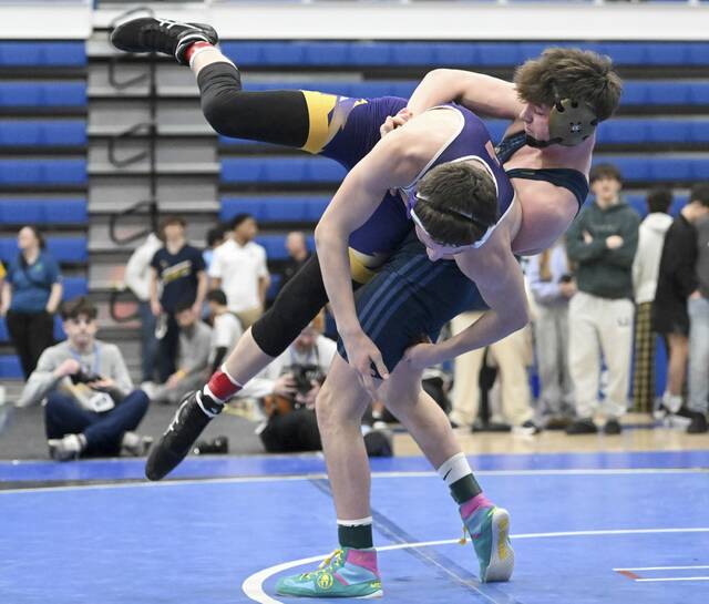 Franklin Regionals Michael Ruane wrestles Plums Owen Campbell in the 152 pound bout during the WPIAL Class 3A wrestling championship Feb. 21 at Canon-McMillan High School. (Chaz Palla | TribLive)