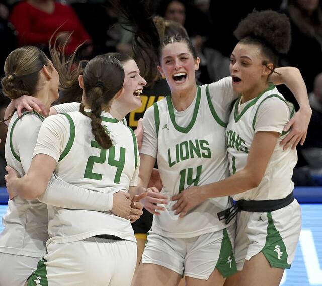The South Fayette girls basketball team celebrates after defeating Thomas Jefferson in the WPIAL Class 5A championship game on Friday, Feb. 27, 2026, at Petersen Events Center. (Christopher Horner | TribLive)